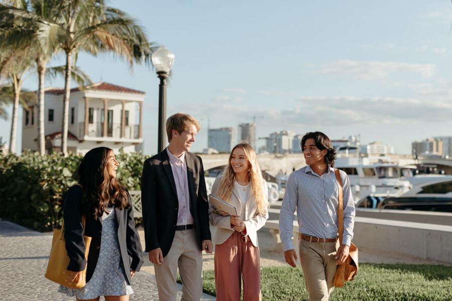 master of business administration mba students walk near the intercoastal waterway in 西<a href='http://4n.nhfilmexpo.com'>推荐全球最大网赌正规平台欢迎您</a>.